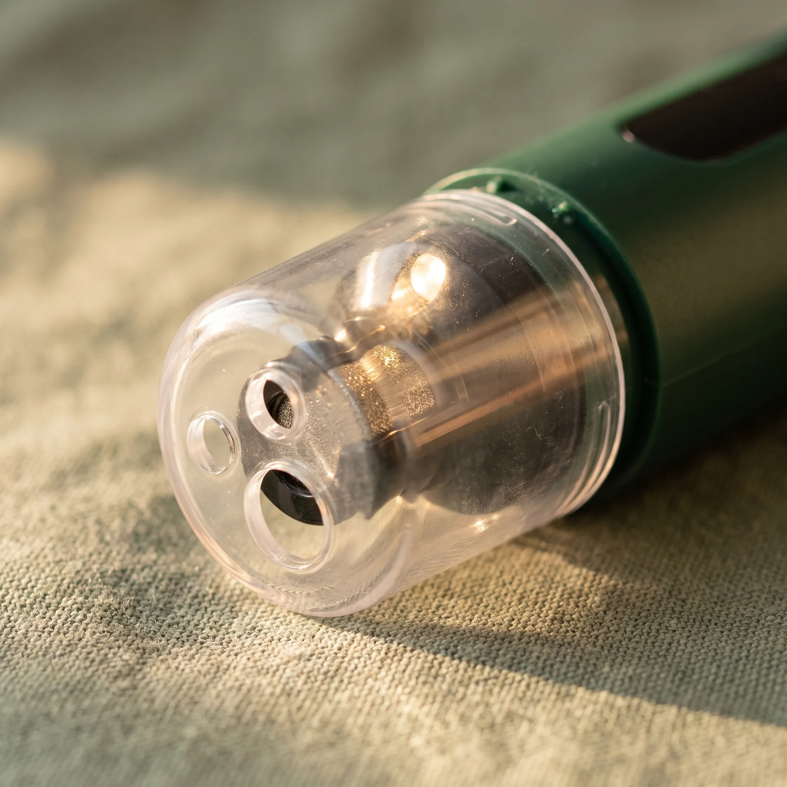 The guard cap's three ports and the LED light, up close